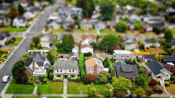 Image of a neighborhood toy replica with suburban houses and roads