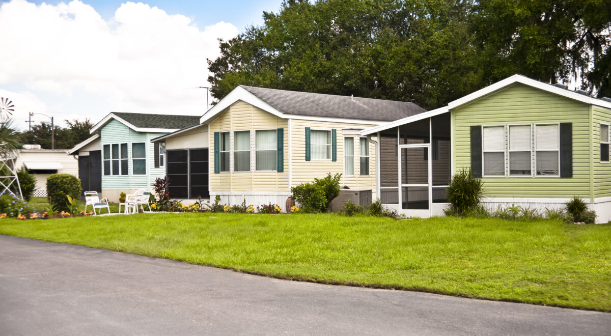 Mobile homes in a manufactured home park. Front yard.