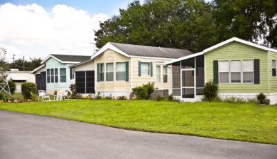 Mobile homes in a manufactured home park. Front yard.